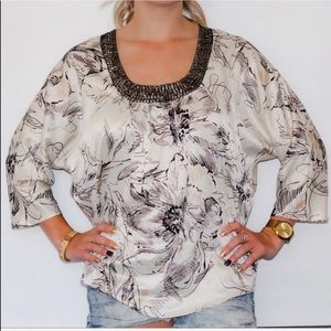 Embellished Yvos blouse has a floral design